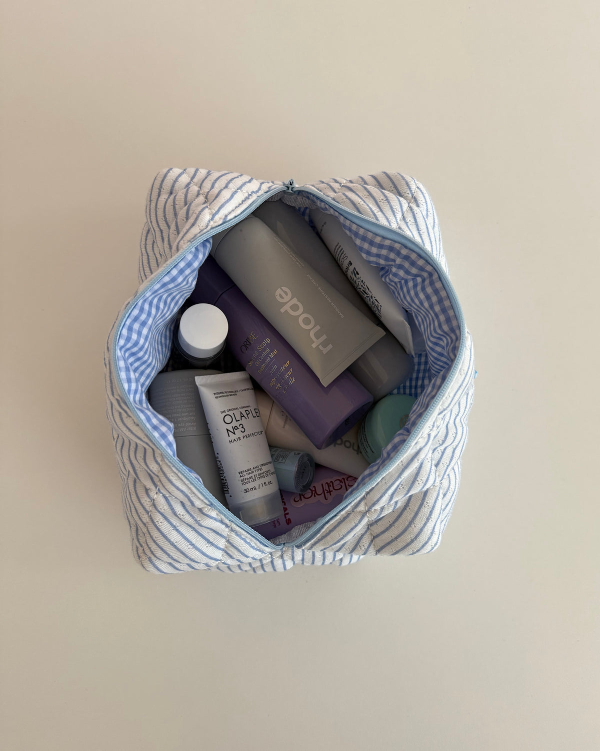 Trousse de maquillage bleu ligné